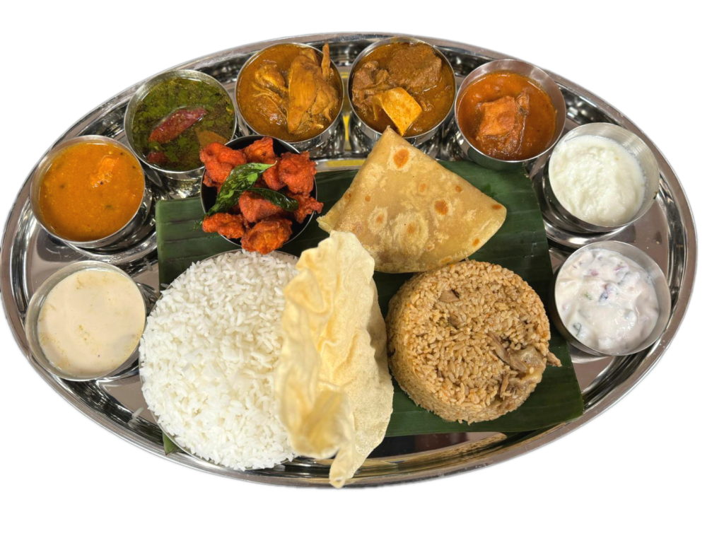 An Indian meal on a silver plate, showcasing a Thali in Austin. A delectable assortment of traditional dishes.
