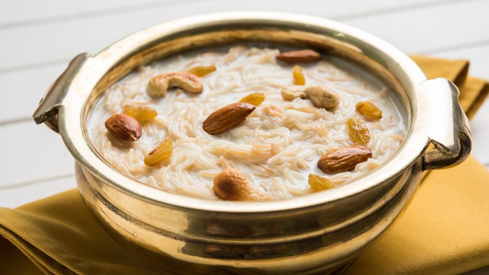 A bowl of Payasam with nuts and raisins, is a delectable South Indian dessert in Austin.