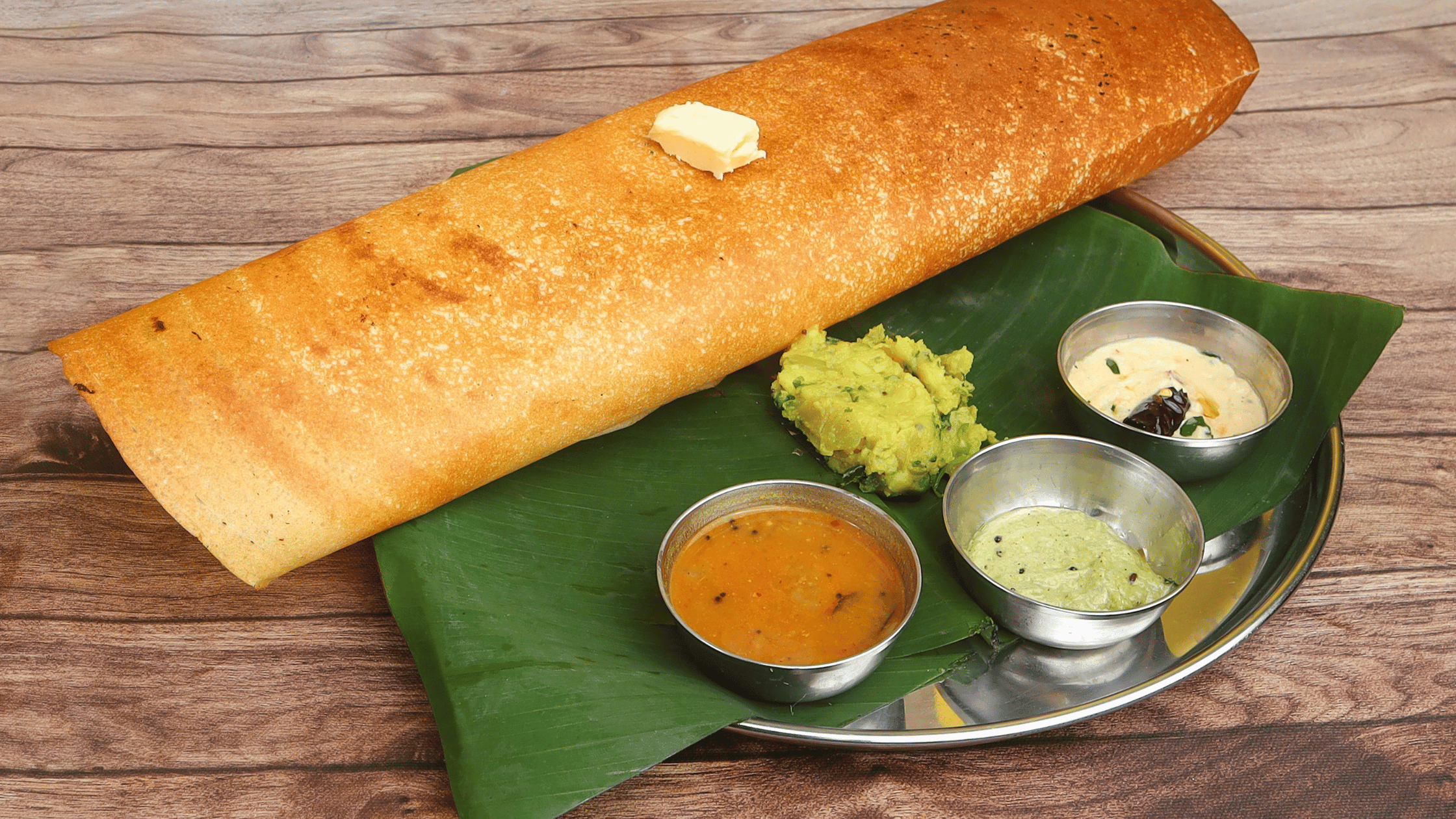 Dosa with chutney and sambhar served at Kuppanna Austin.