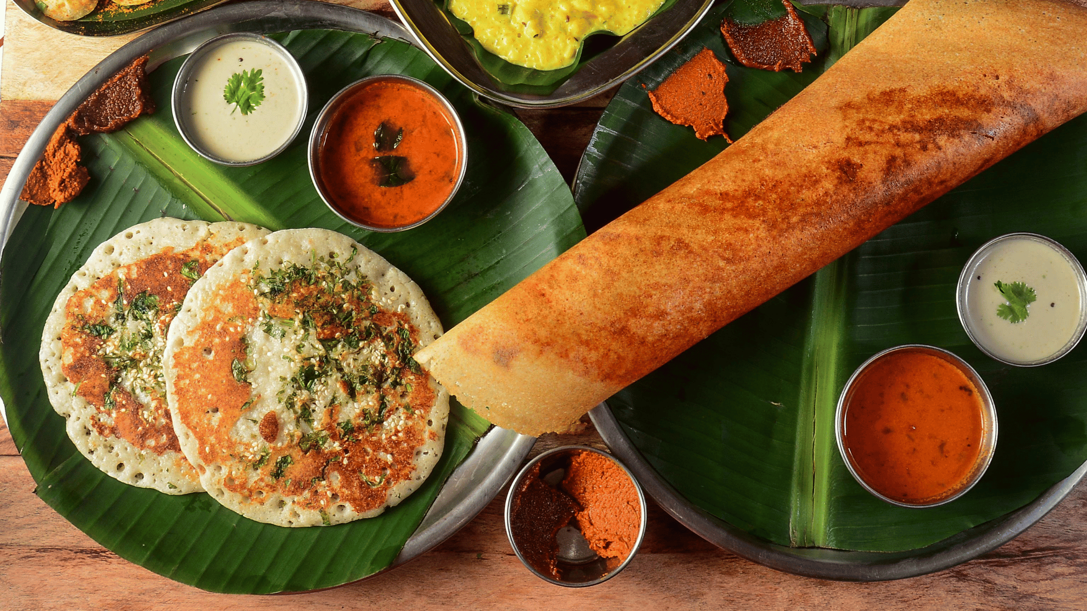 Variety of Indian dishes served in banana leaf