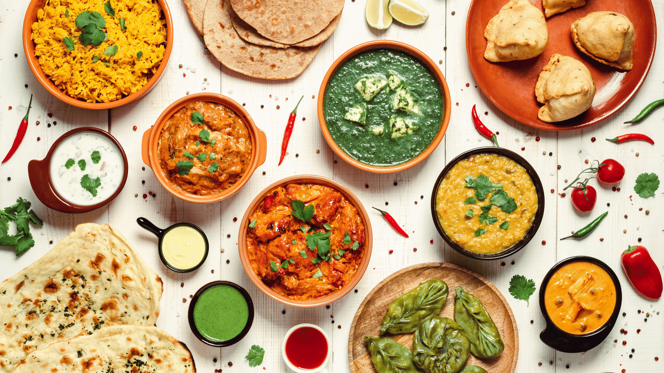 Authentic Indian food spread at Kuppanna Austin – showcasing flavorful curries, rice, naan, and samosas for dine-in experience in Texas