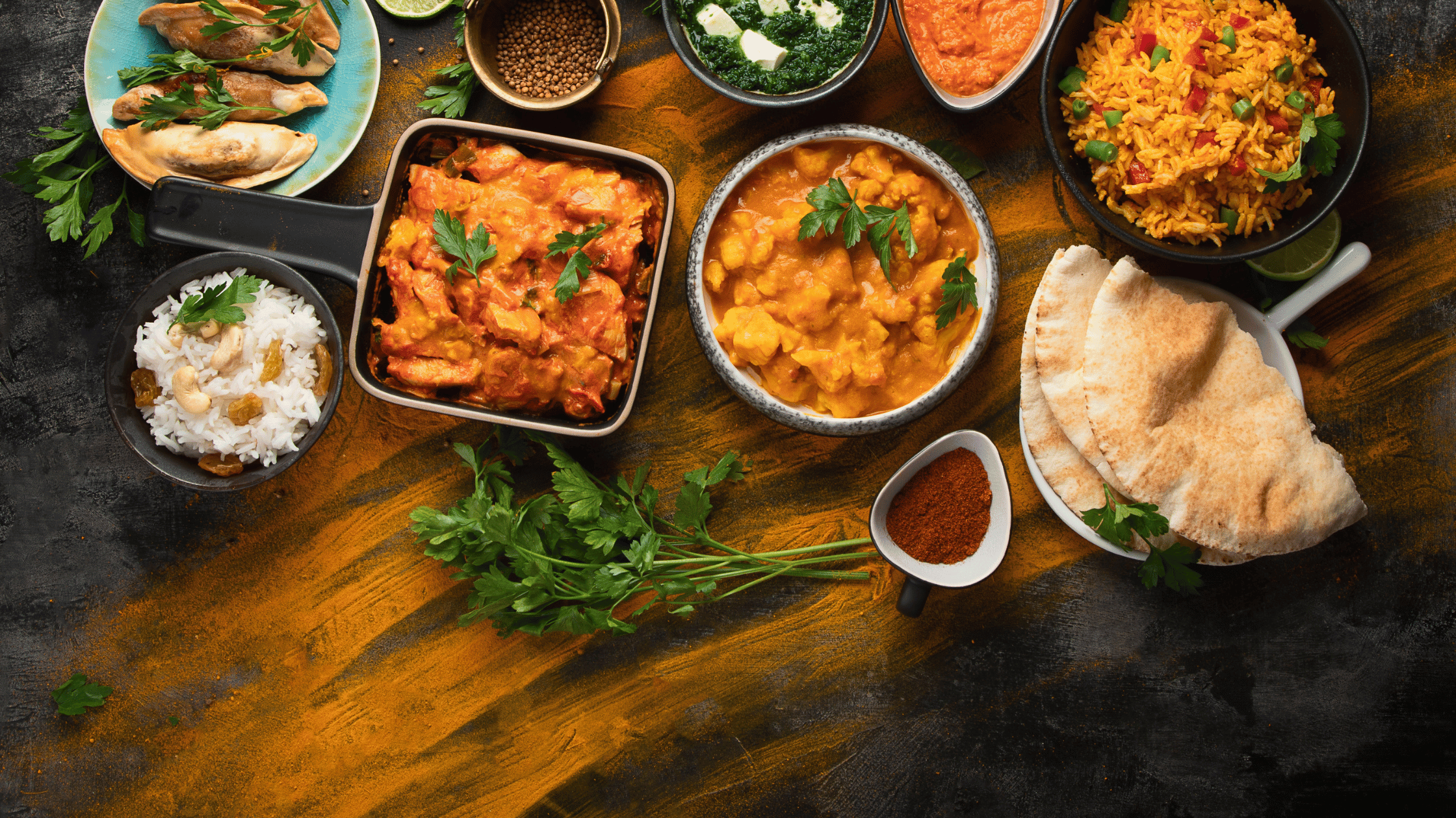 Authentic Indian cuisine featuring basmati rice, naan, paneer, dal, curry, and samosas at Kuppanna Indian Restaurant in Austin